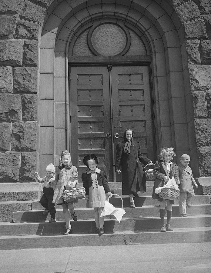 Children of the Polish community in Buffalo leaving church with Easter baskets