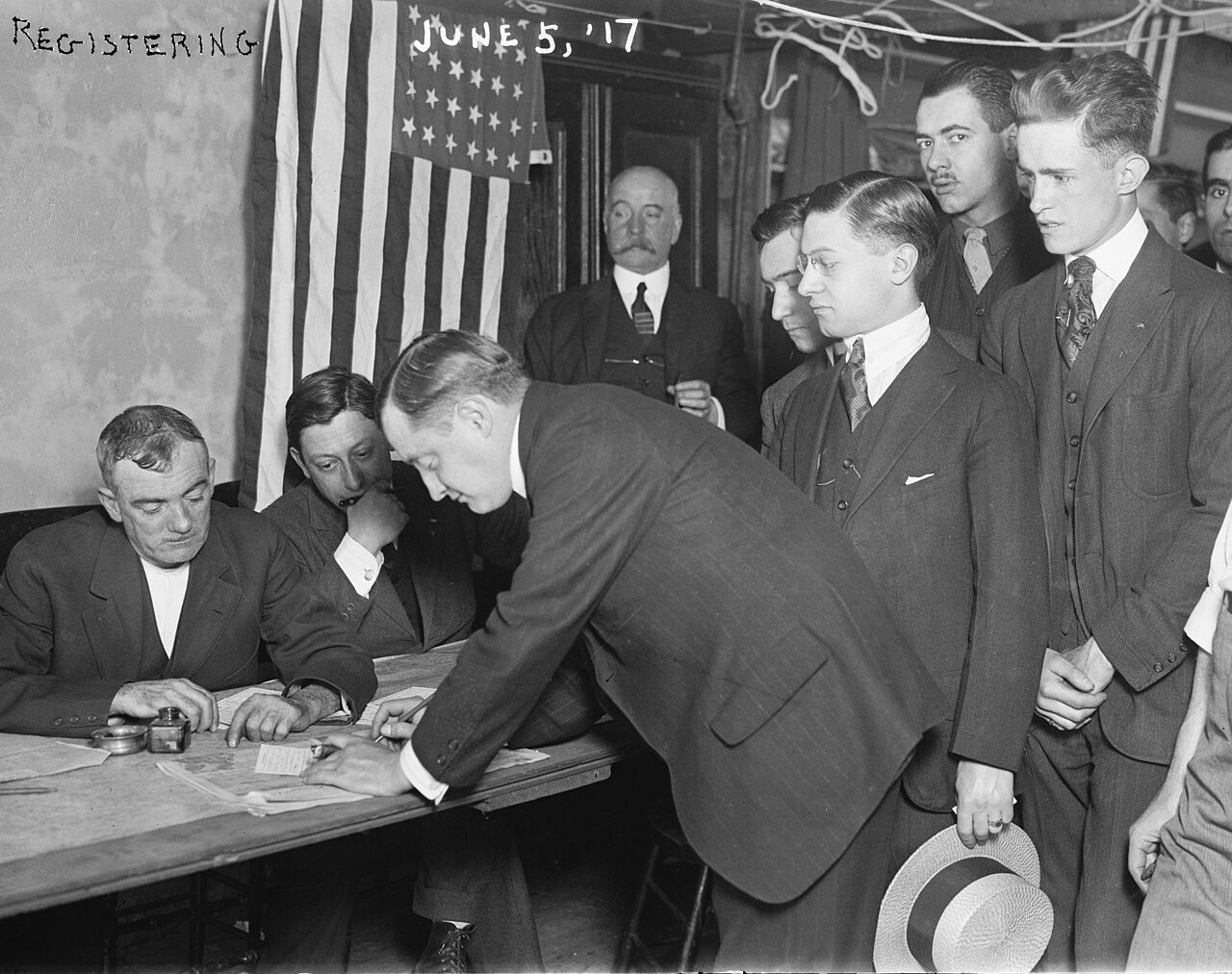 Young men signing draft registration cards in New York City, June 5, 1917