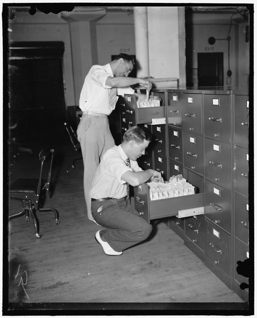 Clerks sorting Social Security number applications into holding files in Baltimore, 1938