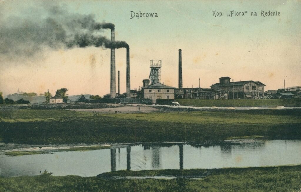 Color postcard of a coal mine with smoking chimneys reflected in a pond, Dąbrowa, 1912